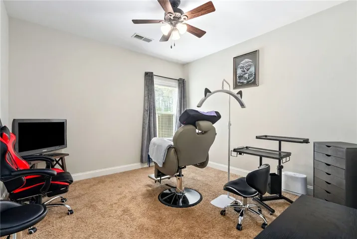 Downstairs bedroom w fan - currently not used as a bedroom