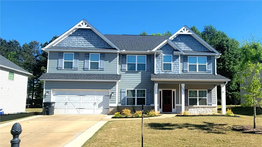 This charming home features a classic design with inviting curb appeal.