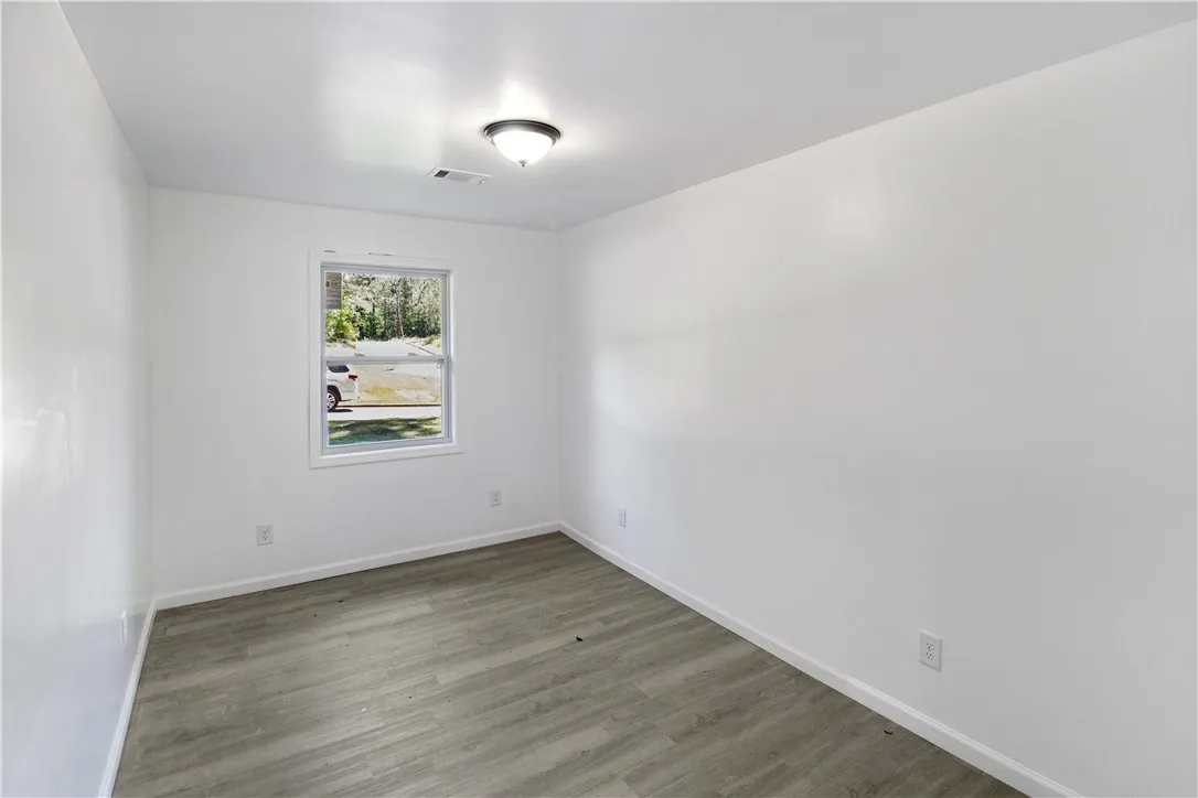This bright room features durable flooring and a window offering natural light.