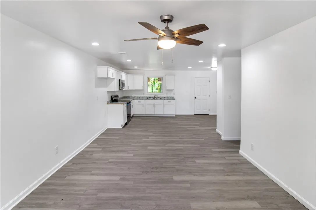 This bright and airy space features an open concept kitchen, perfect for everyday living.