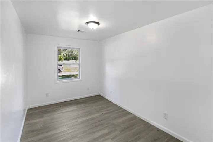 This bright room features durable flooring and a window offering natural light.