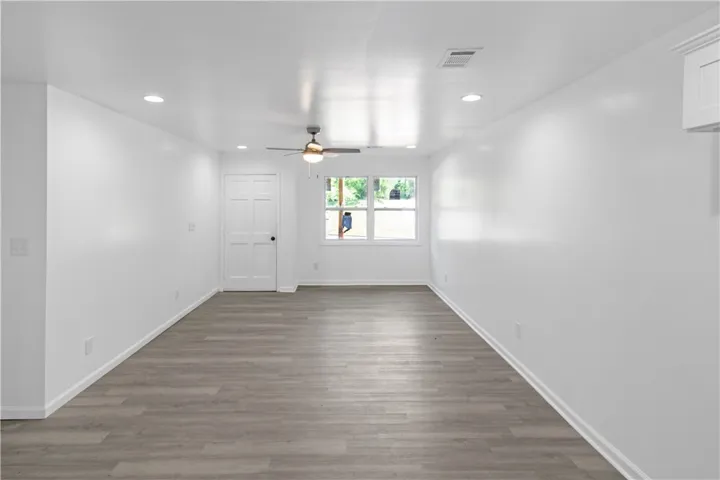 This bright, spacious room offers a versatile living space with ample natural light.
