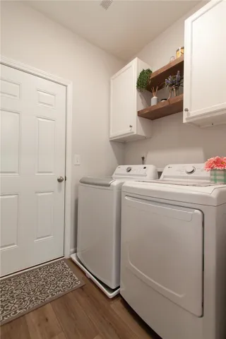Laundry with Added Cabinets
