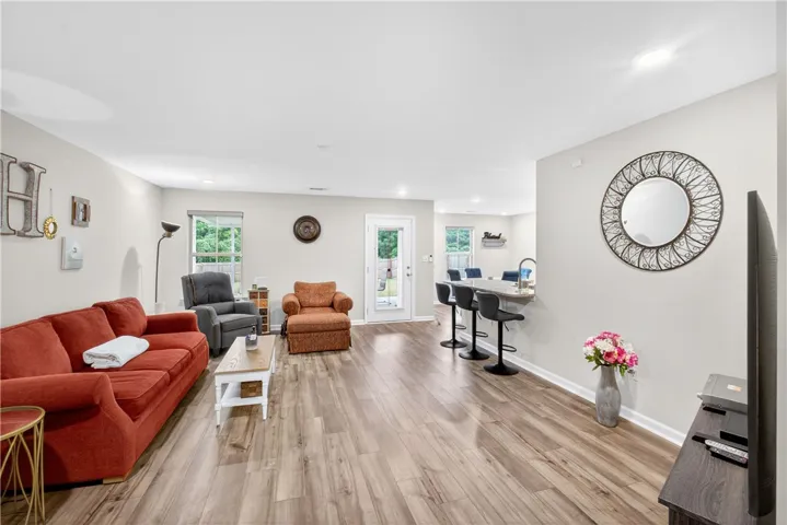 Relax in this comfortable living space with durable flooring and abundant natural light.