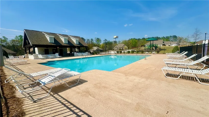 Relax poolside at this community oasis, featuring a sparkling pool and a charming pavilion.