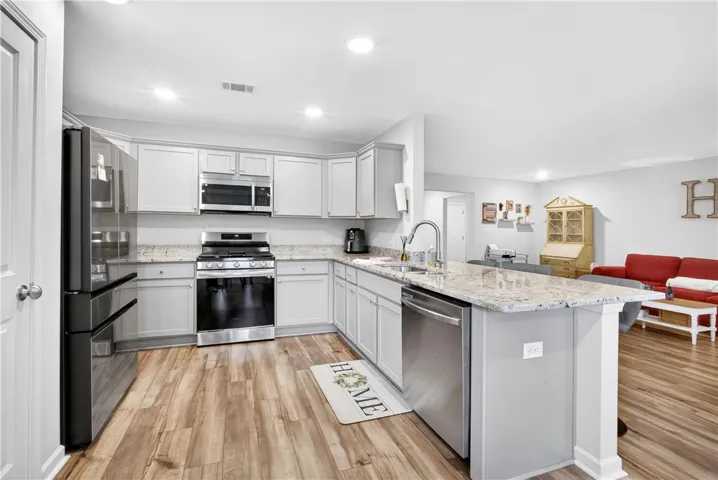 Culinary delights await in this modern kitchen with extensive counter space and an open flow to living areas.
