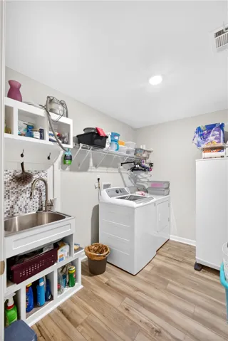 A well-appointed utility area with ample storage and functional design.