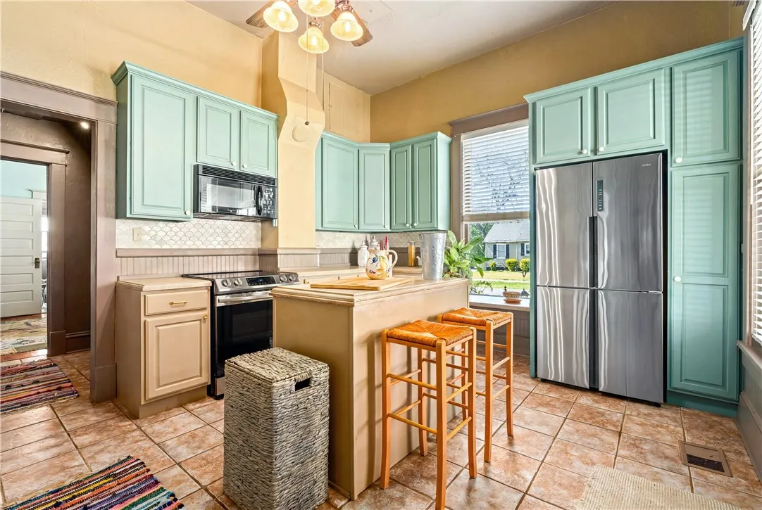 charming kitchen with less than two year old appliances.  Induction stove and cabinet depth refrigerator.