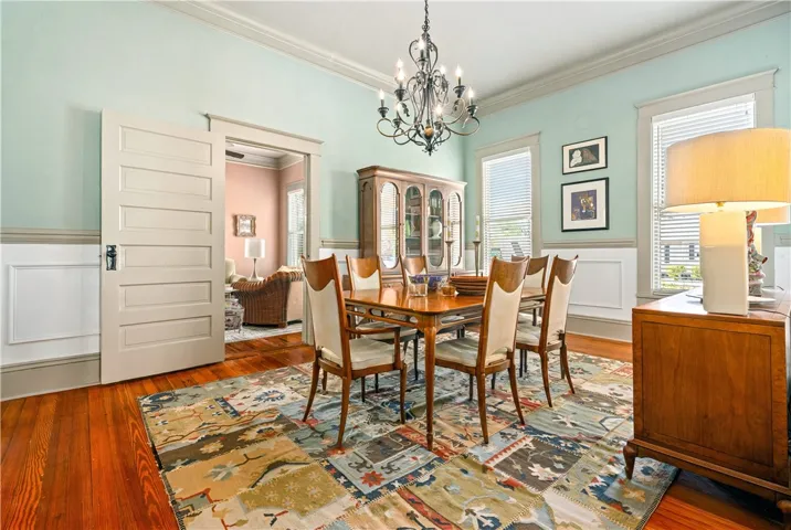 large dinng with warm heart pine original floors.
