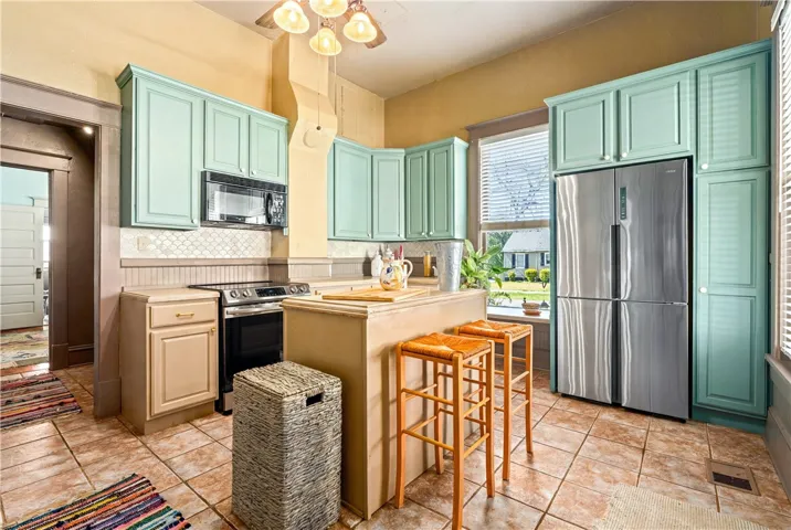charming kitchen with less than two year old appliances.  Induction stove and cabinet depth refrigerator.