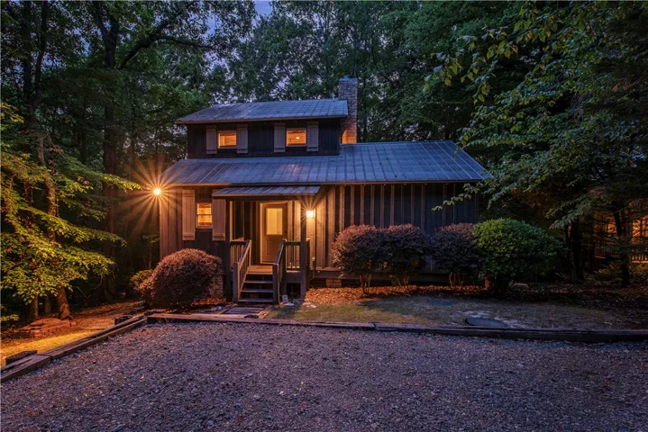 This charming home offers a cozy retreat amidst nature, perfect for peaceful living.