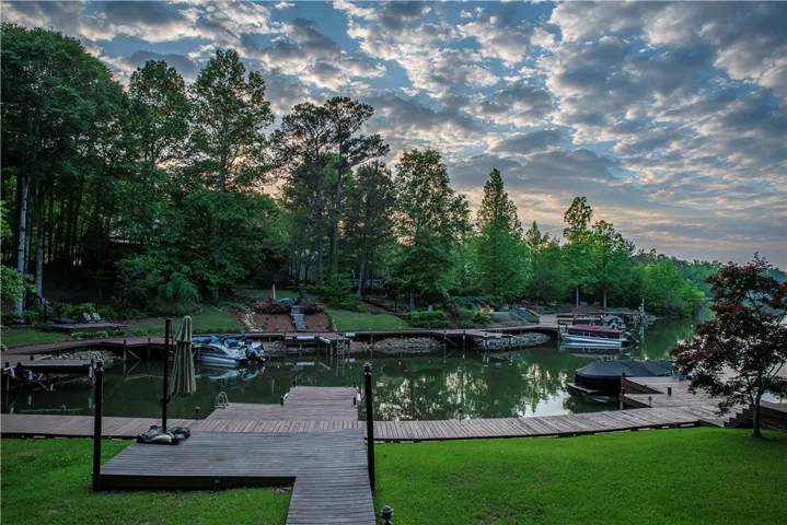 This serene waterfront retreat offers direct access to the lake with multiple boat slips.