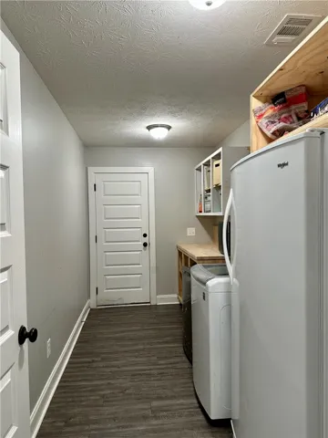 Spacious laundry area
for essential appliances.