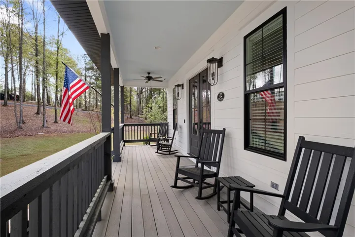 Rocking chairs on the front porch offer a warm welcome to neighbors and guests.