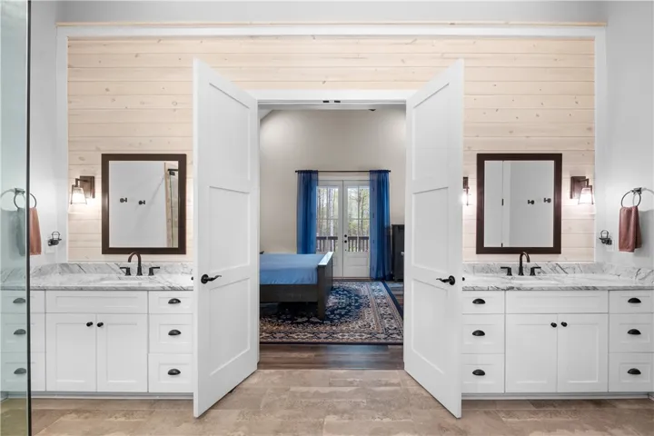 Dual vanities provide both balance and ample space for storage and privacy.