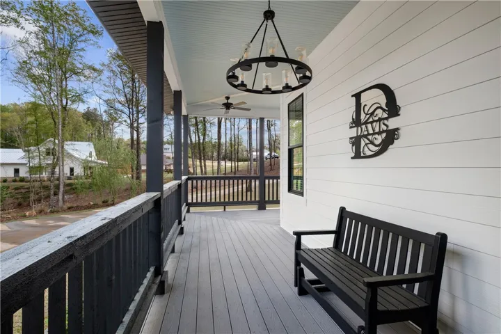 A wraparound porch extends along two sides of the home.