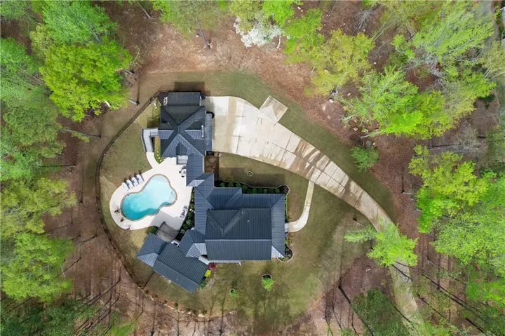 Aerial view showcasing the full property and surrounding landscape.