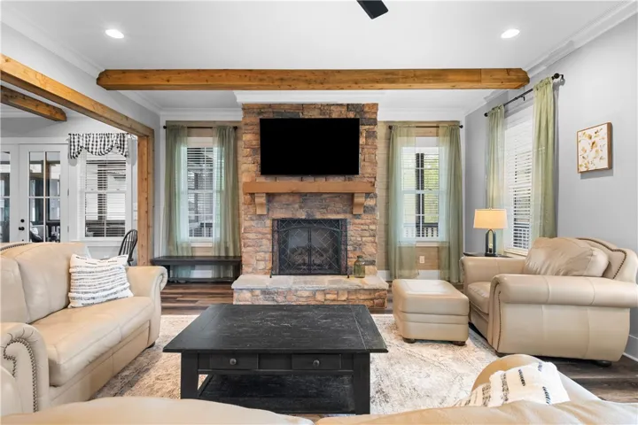 Windows flanking the fireplace offer architectural appeal.