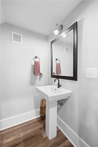 The powder room is conveniently located off the living room.