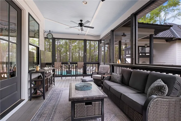 The screened porch takes full advantage of the property’s setting and views.