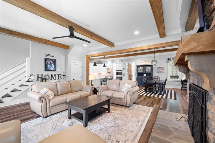 Open living room with seamless flow to the breakfast area and kitchen, plus a conveniently located powder room.