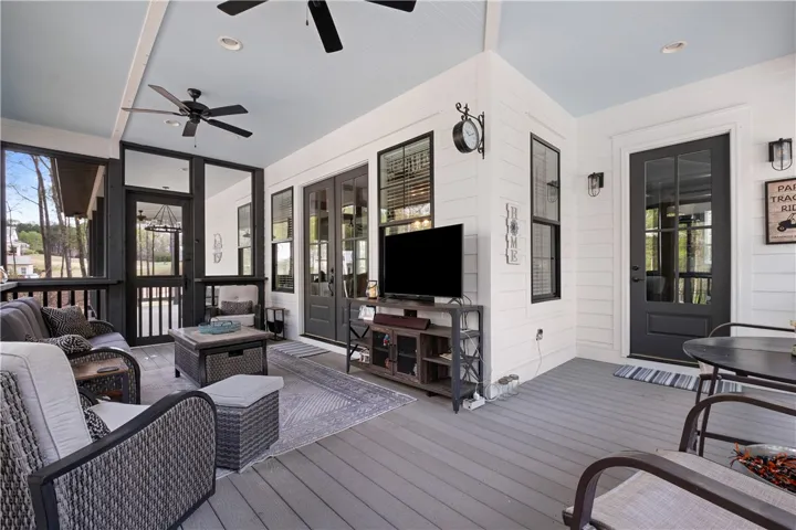 Expansive screened porch with access to the living room, mudroom, and adjoining covered porch.