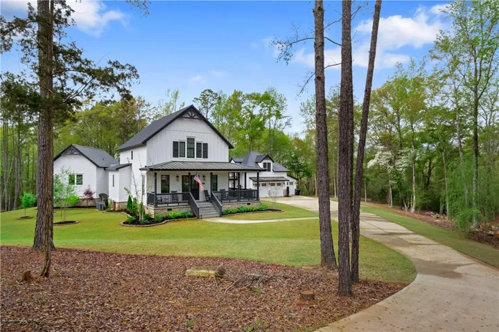 Located along a winding drive, the house has a stately and private presence.