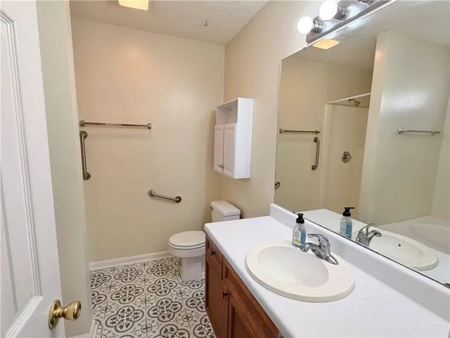 Primary Ensuite Bath with Updated Tile Flooring