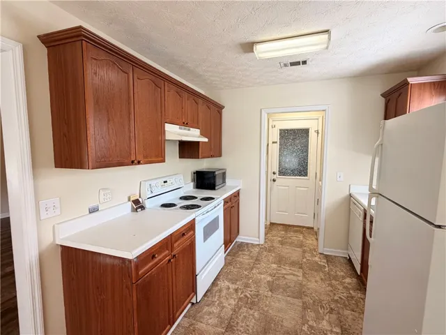 Kitchen view into Laundry and Garage
