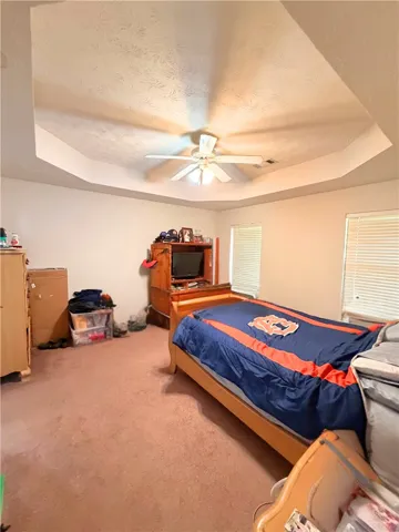 Primary Bedroom w/Ensuite Bathroom and Large Walk-In Closet - Photo Edited to Remove Items Not Material to Property