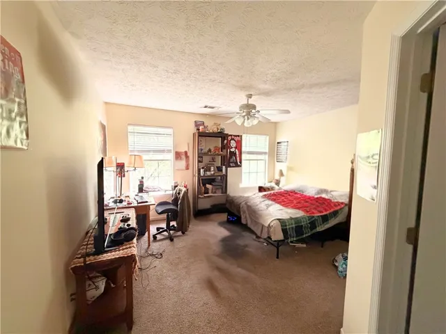 Primary Bedroom Upstairs with Ensuite Bathroom - Image has been edited to remove personal items of tenant