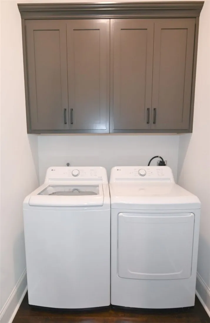 Laundry includes extra storage.