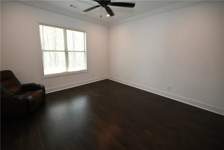 Lovely hardwooded primary bedroom.