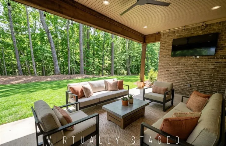 Large covered patio is the perfect place to relax or entertain!