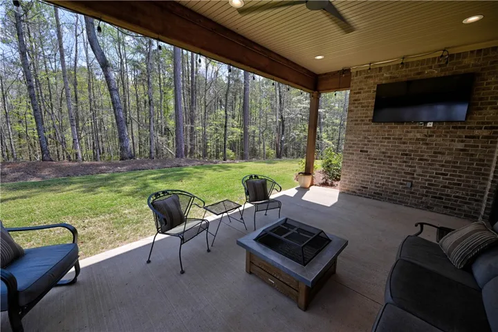 Cozy outdoor covered patio with so much to offer!