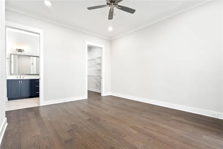 MAIN LEVEL PRIMARY SUITE WITH WALK IN CLOSET & PATIO ACCESS