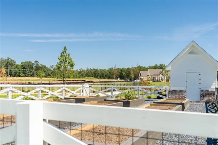 ABOVE GROUND COMMUNITY GARDEN WITH TOOL SHED