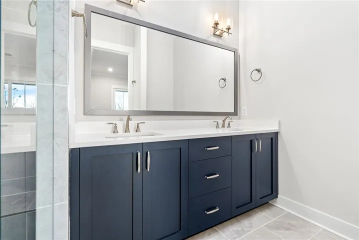 MAIN LEVEL PRIMARY SUITE WITH WALK IN CLOSET & PATIO ACCESS