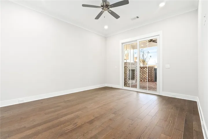 MAIN LEVEL PRIMARY SUITE WITH WALK IN CLOSET & PATIO ACCESS