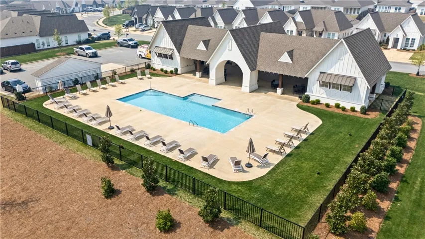 Neighborhool pavilion w/expansive tanning deck, covered spaces/bathrooms & pool.  Short stroll just behind your home!