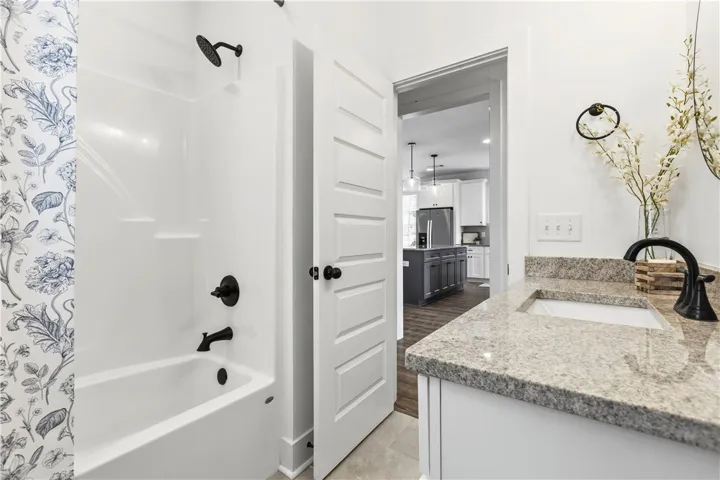 Nice to see a well-laid out guest bath.  Flows well for brief or overnight guests.