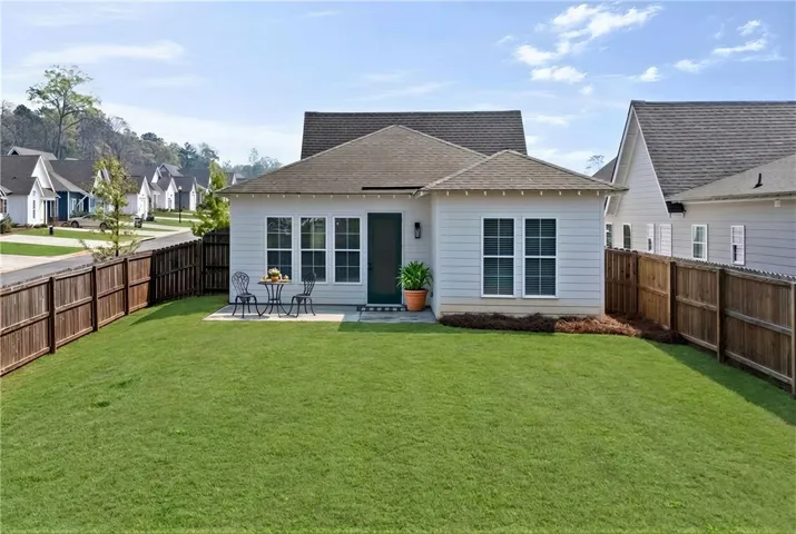 Patio space to enjoy a meal or absorb some Vitamin D.  (Grass has been virtually enhanced to resemble spring!)