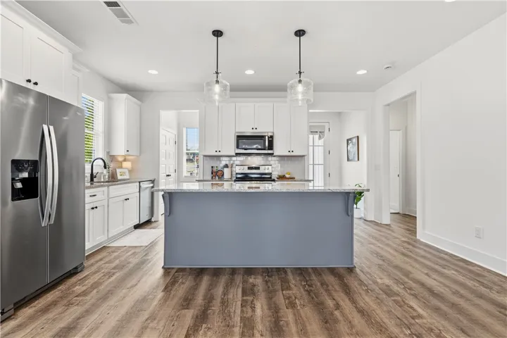 Heading back towards the front, tucked away to the right are the two guest suites & hall bath.