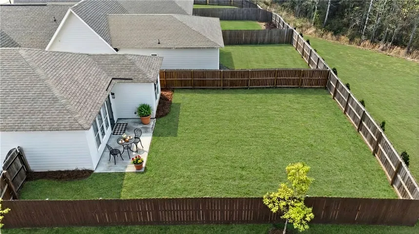 Fully fenced & flat yard on corner lot with trees for back neighbors - rare find!! (Grass has been virtually enhanced to resemble spring!)