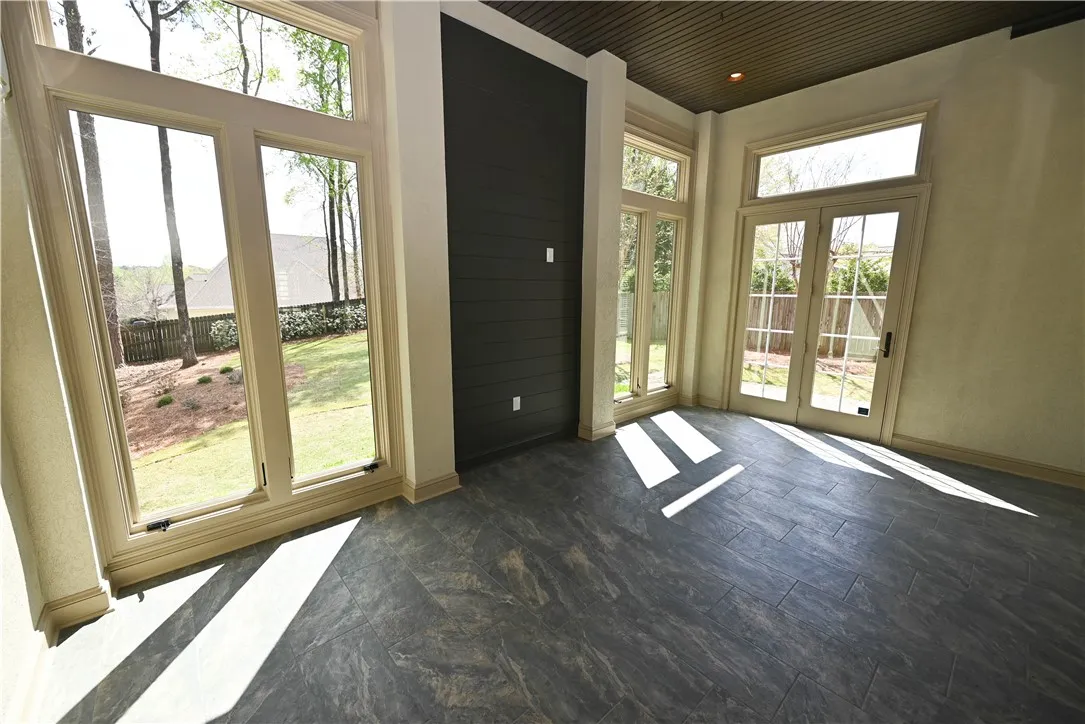 Huge enclosed patio space with floor to ceiling windows!