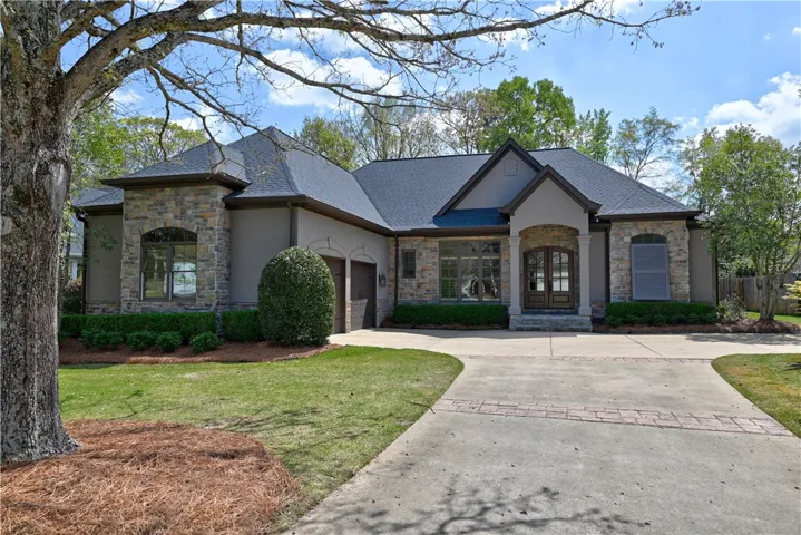 Columned arches leading to the elegant double doors!