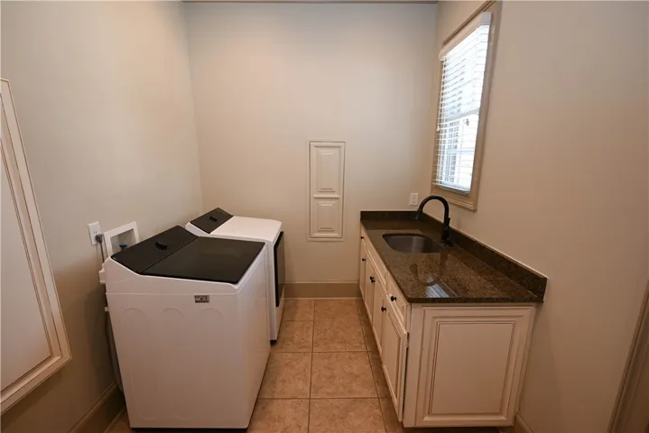 Laundry room with counter space and sink!