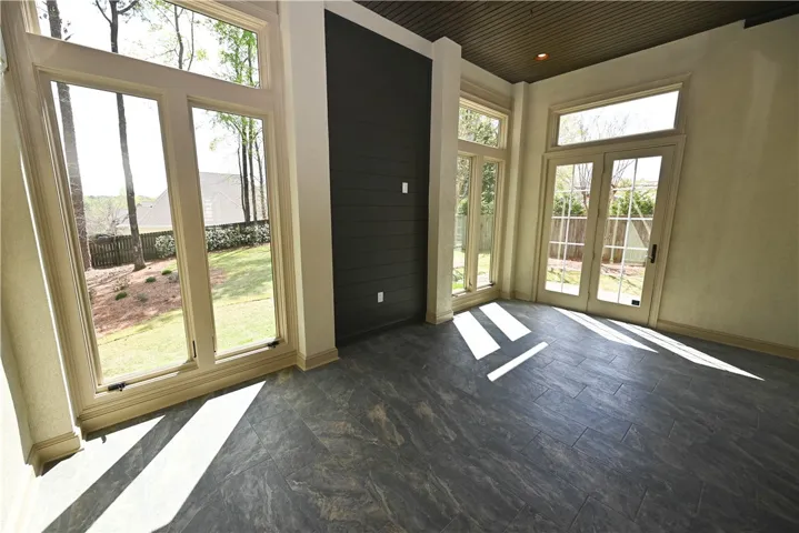 Huge enclosed patio space with floor to ceiling windows!