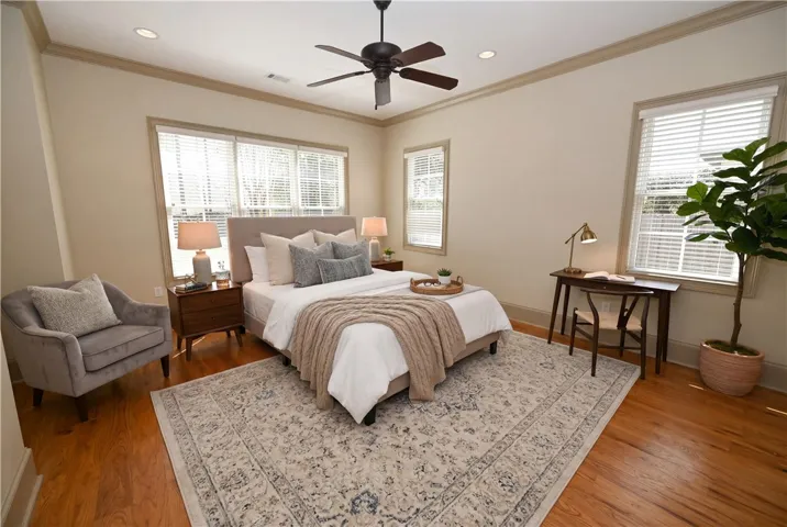 Bright primary bedroom (DIGITALLY STAGED)