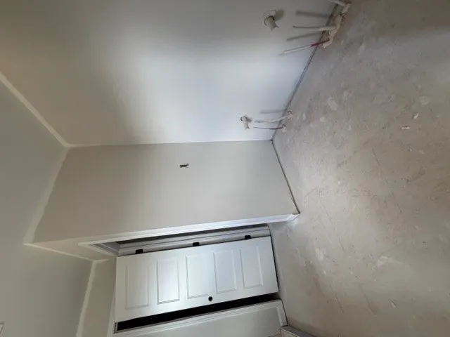 This versatile space awaits your personalized design, ready to become a bathroom or laundry area.
